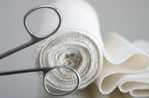 first aid kit isolated over reflective surface